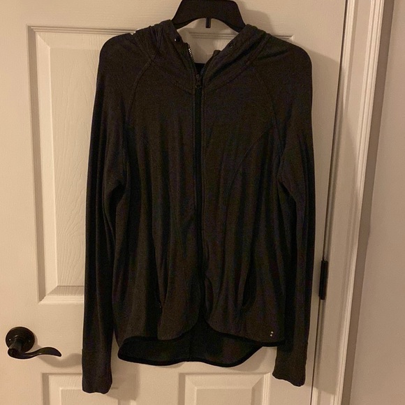 Zip up athletic sweatshirt with zip up pockets and a hood. - Picture 1 of 2